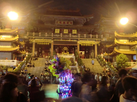 A temple by Lotus Pond, seen through the night market