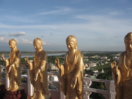 Small statues of Amitabha Buddha (edging the plaza and steps by the big statue) at Foguangshan Monastery