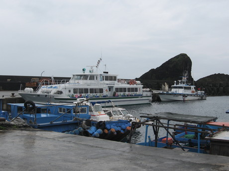 Our ferry and a coast guard vessel in Kaiyuan harbour