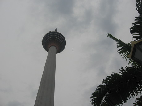 Menara KL, with two BASE jumpers (the little dots near the tower)